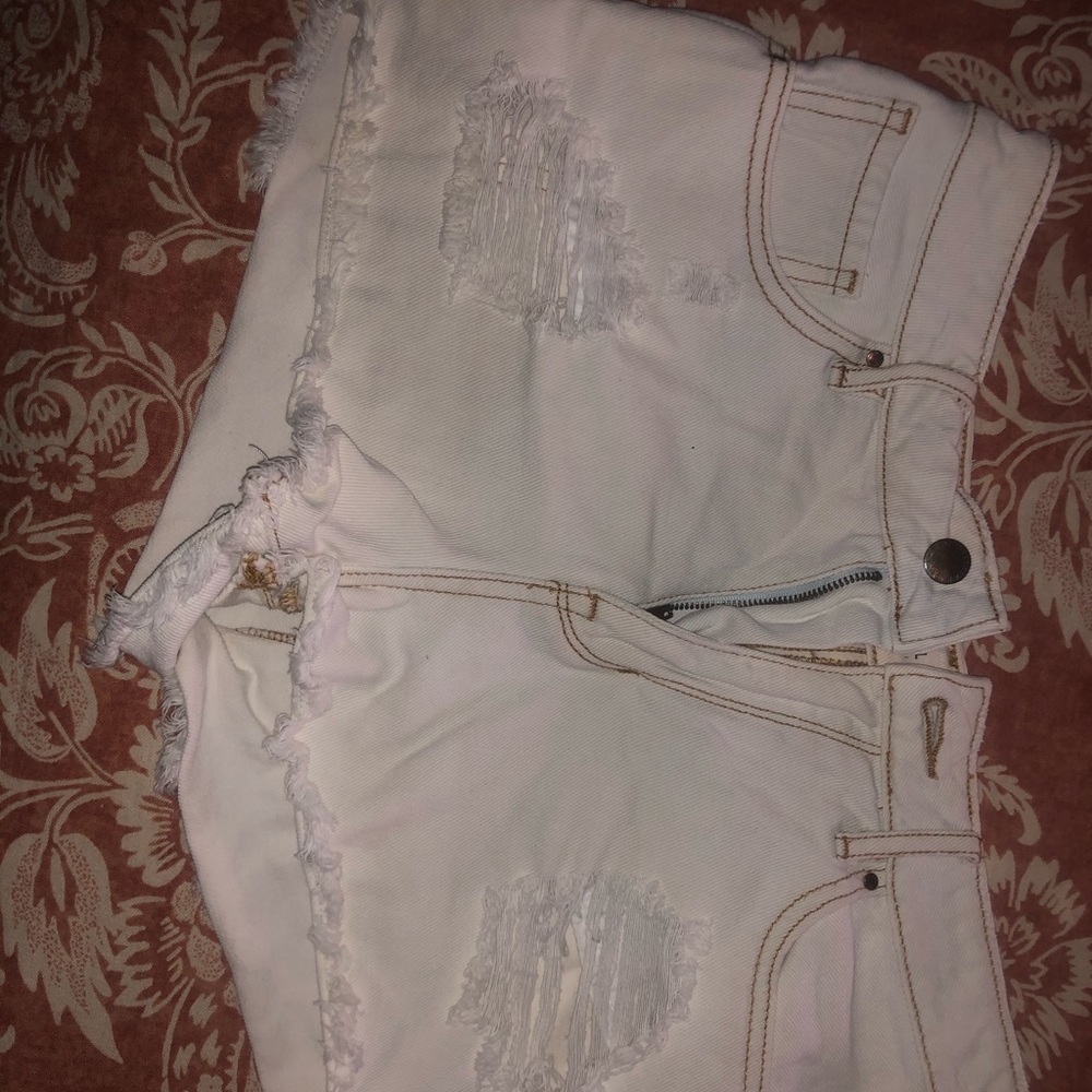 White distressed jean shorts